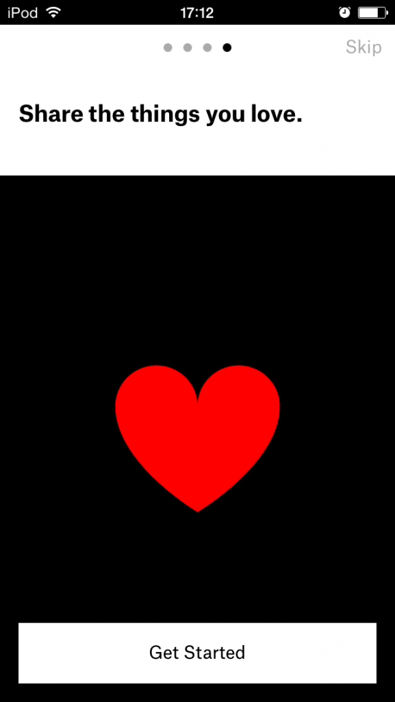 A screenshot from the Ello iOS app showing a red heart against a black background, with the words "Share the things you love."
